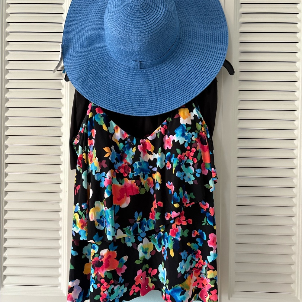 Pretty tankini. Small skirted bottom. Large ruffled top with adj straps. NWT hat